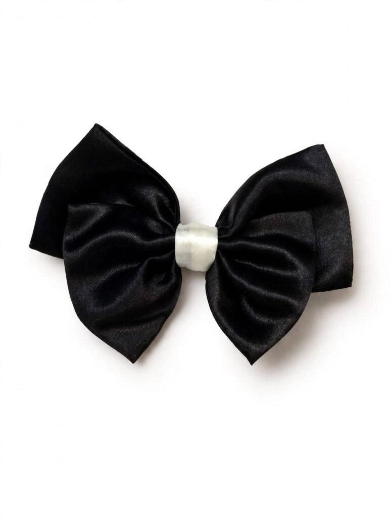 Stylish black satin bow hair clip with white center